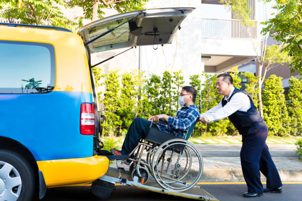  A parked white van featuring yellow and blue stripes, designated for private medical transportation, alongside the road.